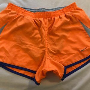 Nike orange sport shorts.  Size S. Pocket in the back for keys. good conditions